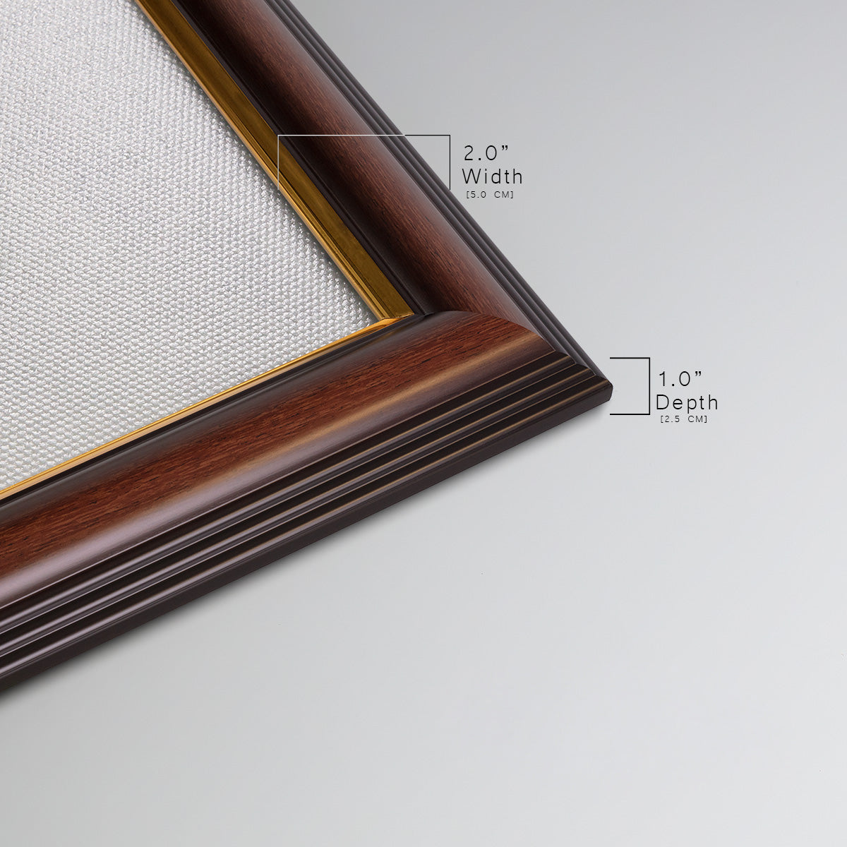 Detail of ornate mahogany wood frame with gold liner.