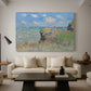 Canvas art print featuring a coastal cliff scene with grass, wind, and expansive sea view, displayed in a spacious living room