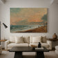 Canvas art print featuring an atmospheric coastal view with horizon, displayed in a spacious living room