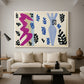 Canvas art print featuring an expressive abstract scene built from directional shapes, displayed in a spacious living room