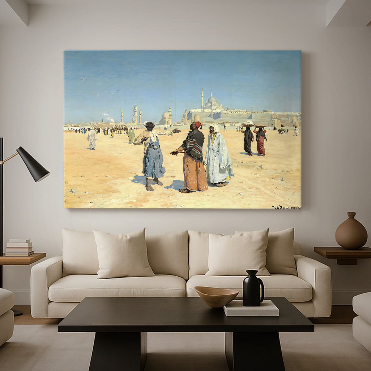 Canvas art print featuring a scene of figures crossing sandy terrain with distant skyline, displayed in a spacious living room