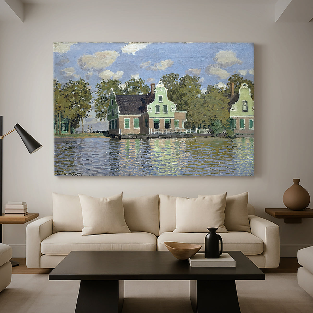 Canvas art print featuring a peaceful canal scene with houses mirrored in water, displayed in a spacious living room