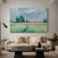 Canvas art print featuring an agricultural landscape with tall wheat and distant horizon, displayed in a spacious living room