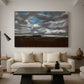 Canvas art print featuring an expansive countryside with cloud cover, displayed in a spacious living room