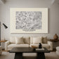 Canvas art print featuring a patterned surface featuring stylized flowers and leaves, displayed in a spacious living room
