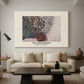 Canvas art print featuring a tapestry-style design with symmetrical botanical elements, displayed in a spacious living room