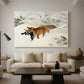 Canvas art print featuring a red fox crossing snow-covered ground under pale sky, displayed in a spacious living room