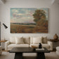 Canvas art print featuring a countryside scene with distant town, displayed in a spacious living room