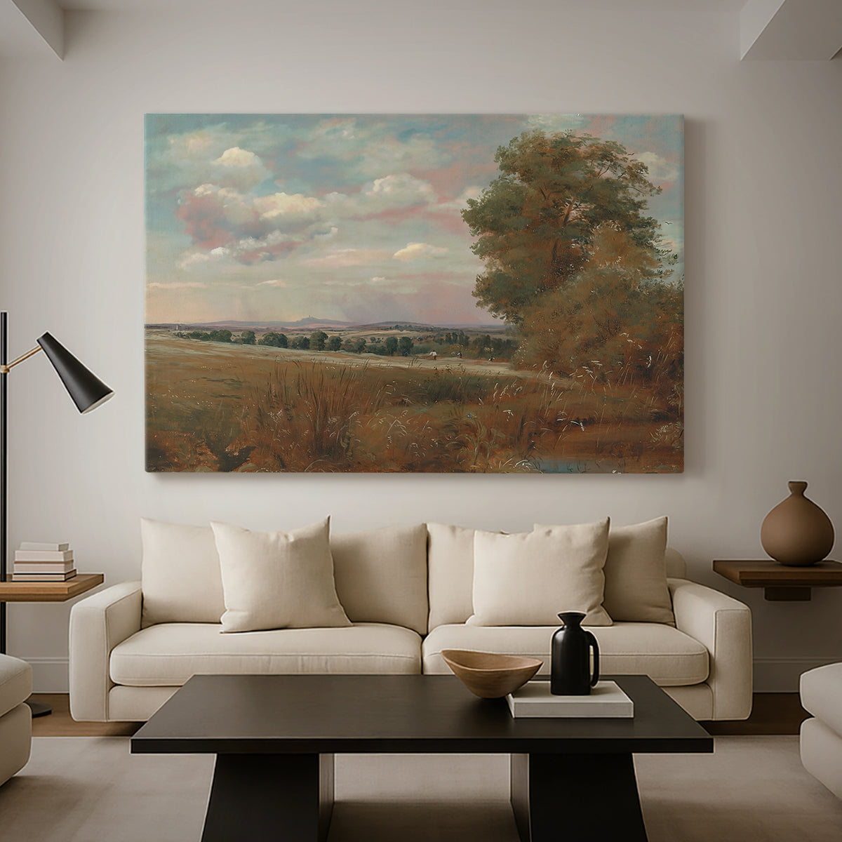 Canvas art print featuring a countryside scene with distant town, displayed in a spacious living room