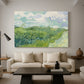 Canvas art print featuring an expressive landscape dominated by green crops and open sky, displayed in a spacious living room