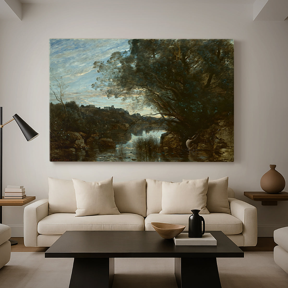 Canvas art print featuring an atmospheric landscape with lake and layered terrain, displayed in a spacious living room