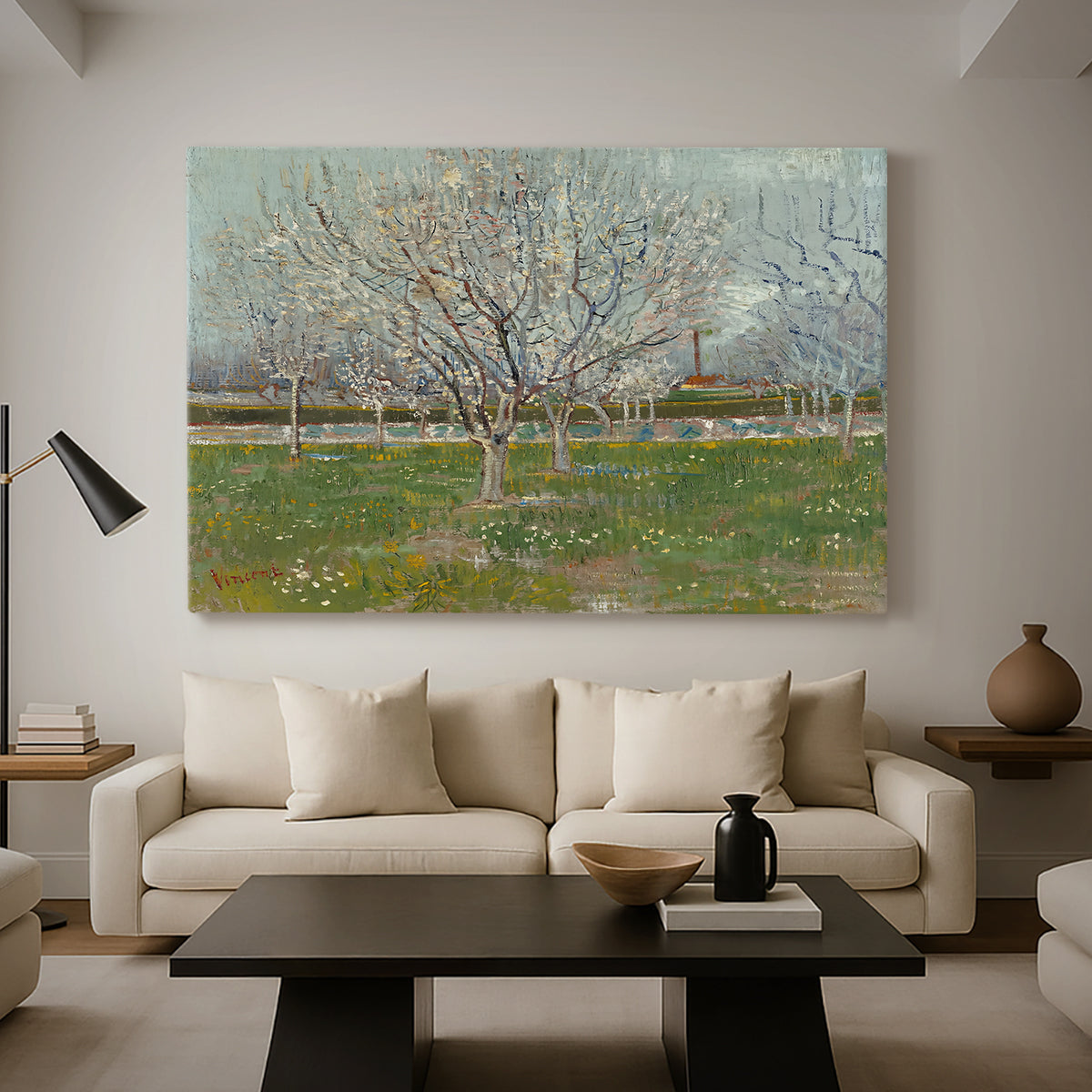 Canvas art print featuring an orchard composition with pale blossoms against open sky, displayed in a spacious living room