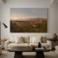 Canvas art print featuring a romantic cityscape integrated into natural terrain, displayed in a spacious living room