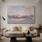 Canvas art print featuring an expressive sky scene with soft color transitions, displayed in a spacious living room