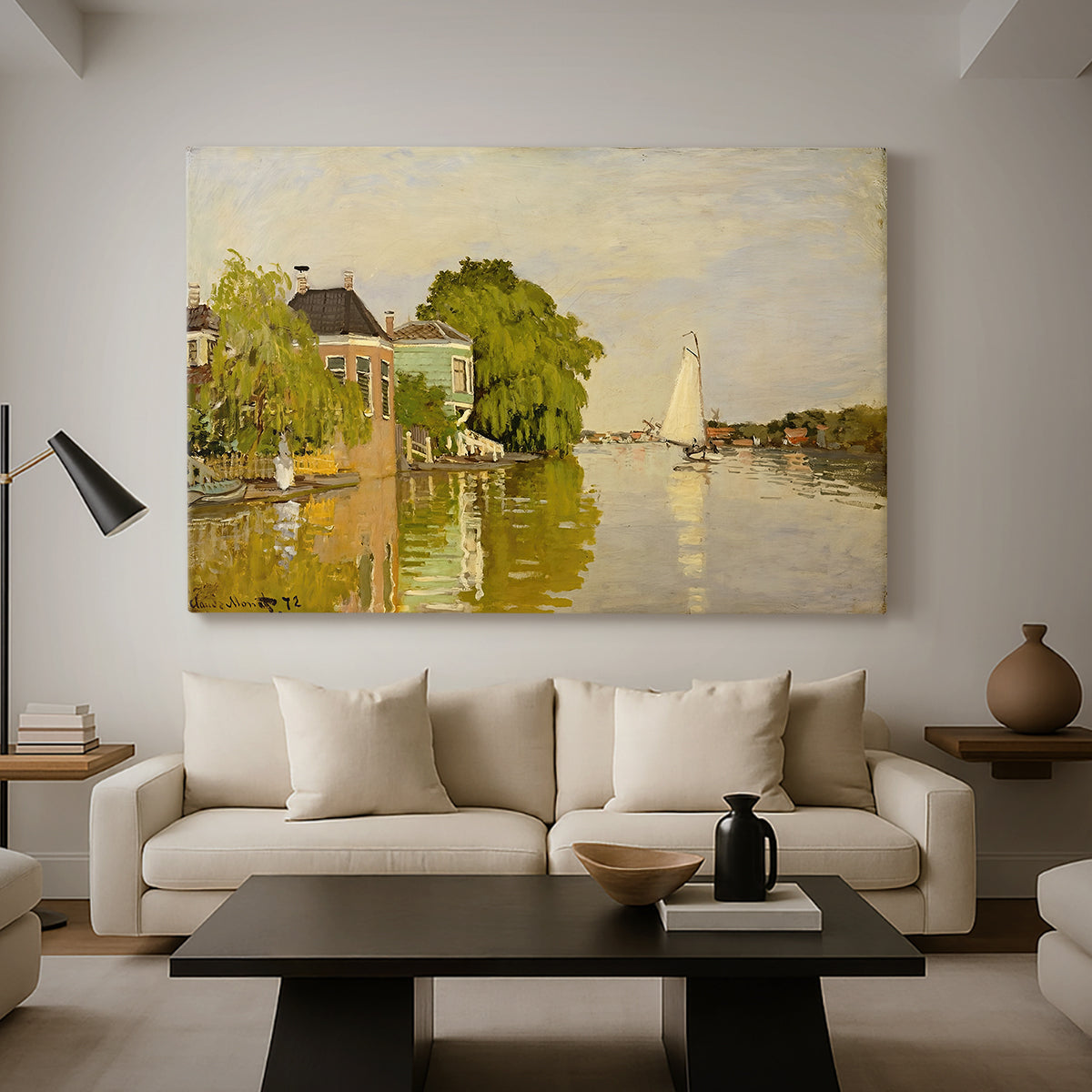 Canvas art print featuring an impressionist landscape with buildings along quiet canal, displayed in a spacious living room