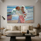 Canvas art print featuring a bright coastal composition with figures and shoreline, displayed in a spacious living room