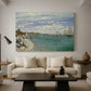 Canvas art print featuring an impressionist coastal view with colorful sails and shoreline activity, displayed in a spacious living room