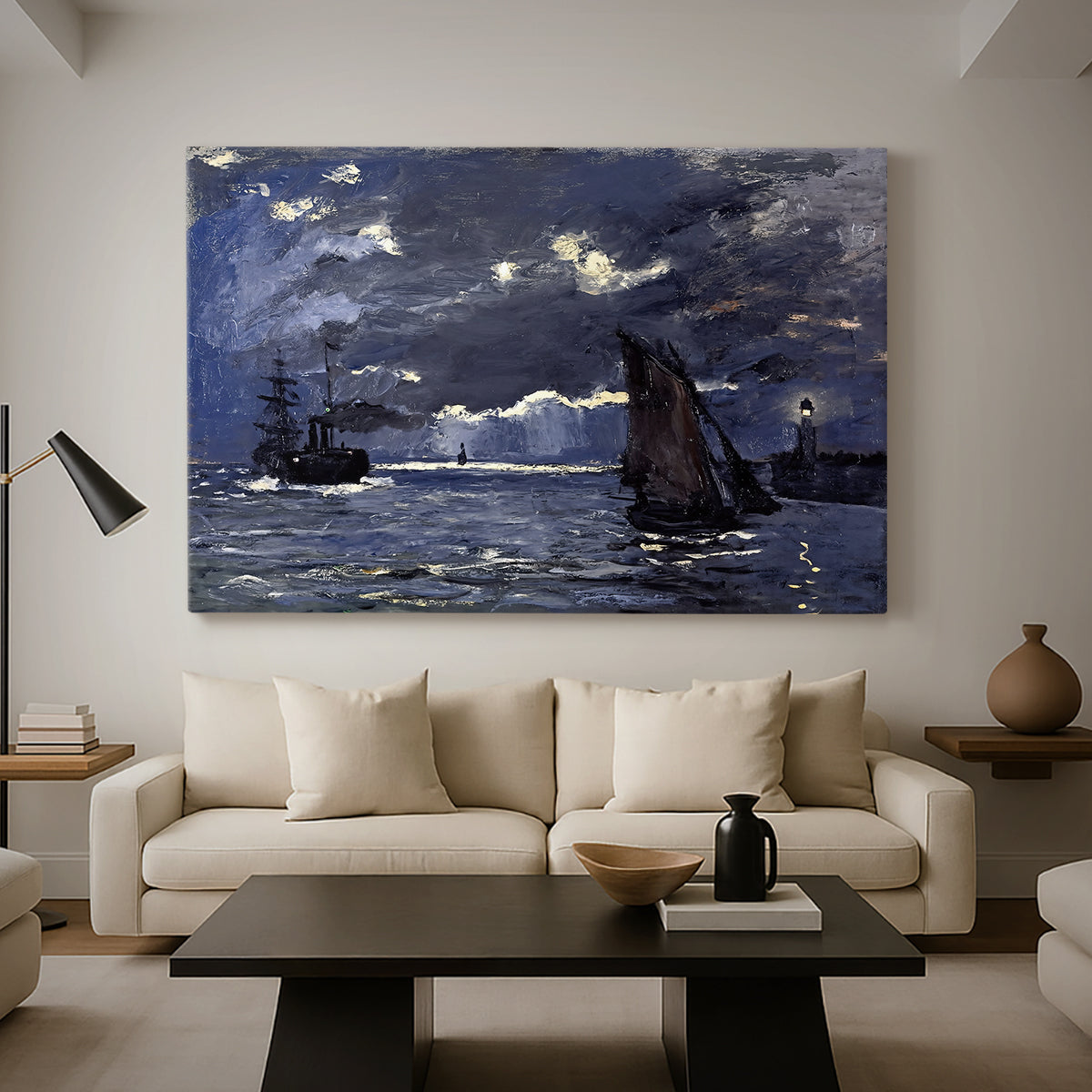 Canvas art print featuring a dramatic ocean scene with light reflecting across water at night, displayed in a spacious living room