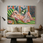 Canvas art print featuring an expressive reclining figure amid floral motifs, displayed in a spacious living room