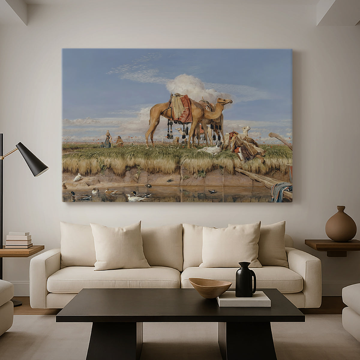 Canvas art print featuring a landscape featuring river, animals, and activity, displayed in a spacious living room
