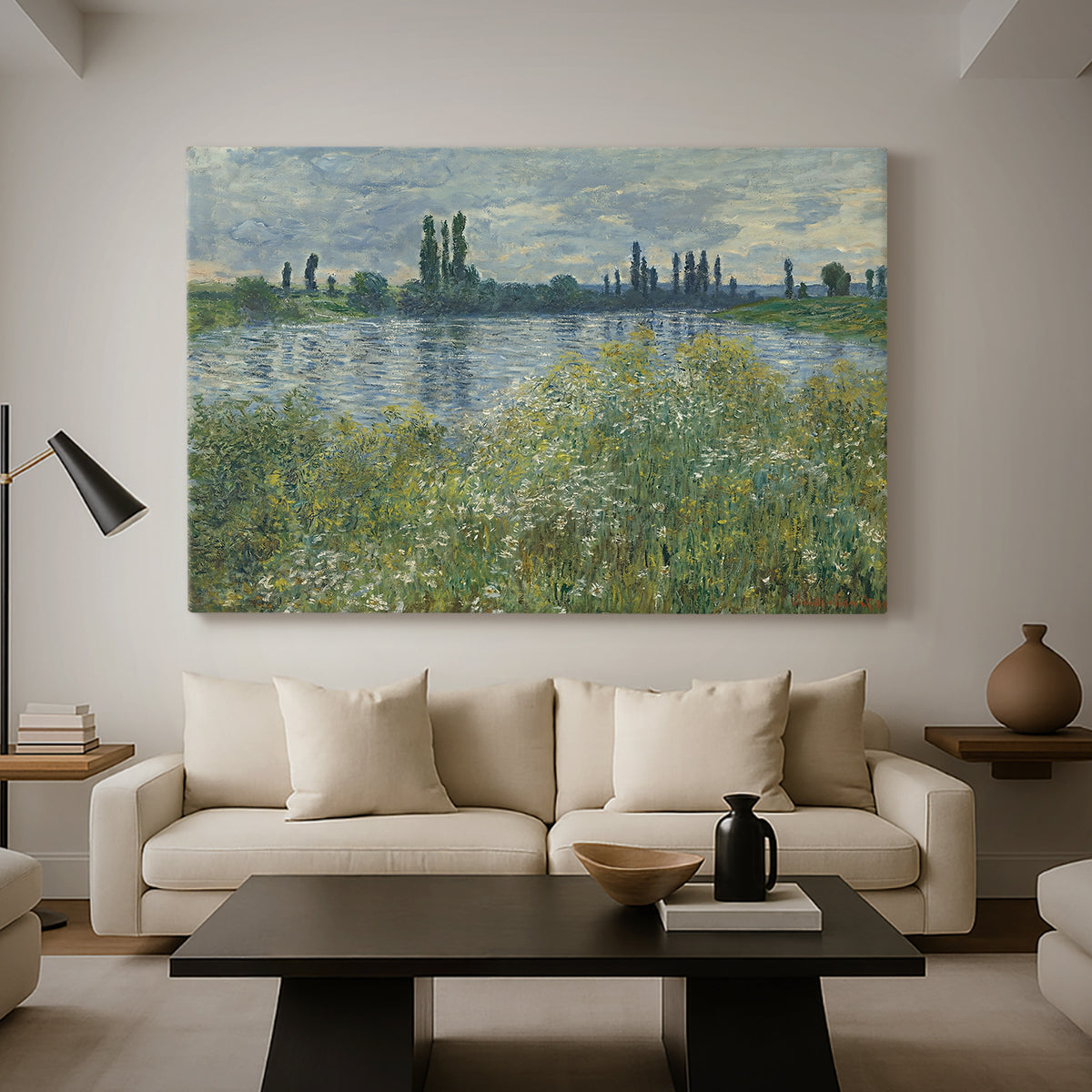 Canvas art print featuring a tranquil riverside scene with houses and vegetation, displayed in a spacious living room