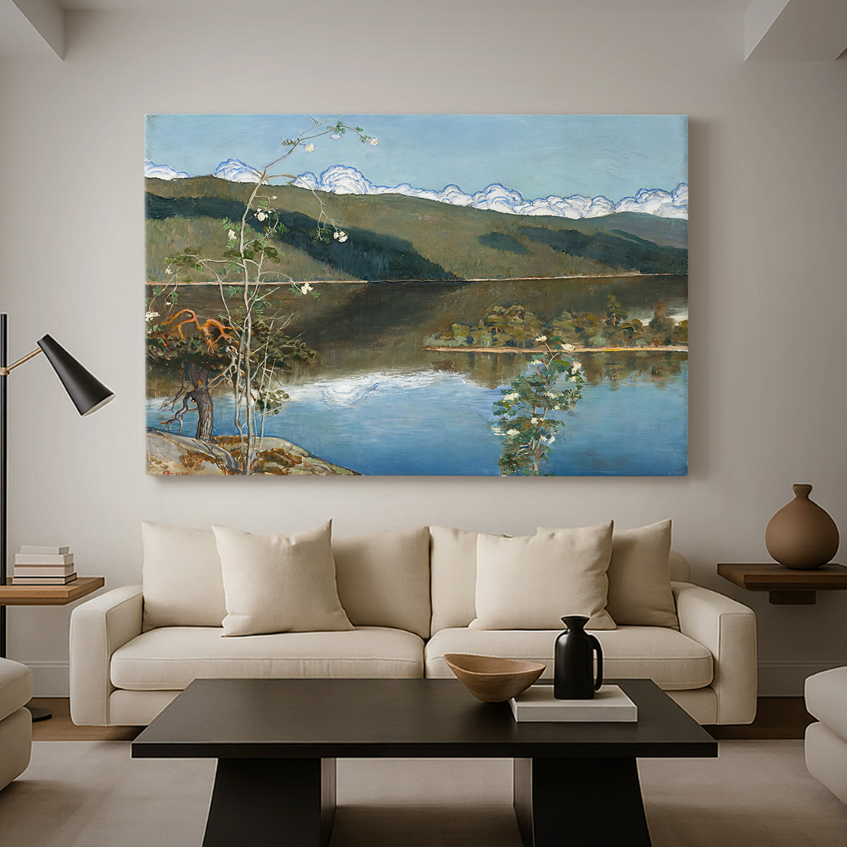 Canvas art print featuring an expansive view of land and water beneath approaching storm clouds, displayed in a spacious living room