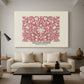 Canvas art print featuring a patterned surface with repeating floral clusters, displayed in a spacious living room