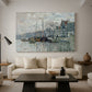 Canvas art print featuring an urban waterway with docked boats and European buildings, displayed in a spacious living room