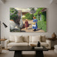 Canvas art print featuring a countryside setting with homes and people outdoors, displayed in a spacious living room