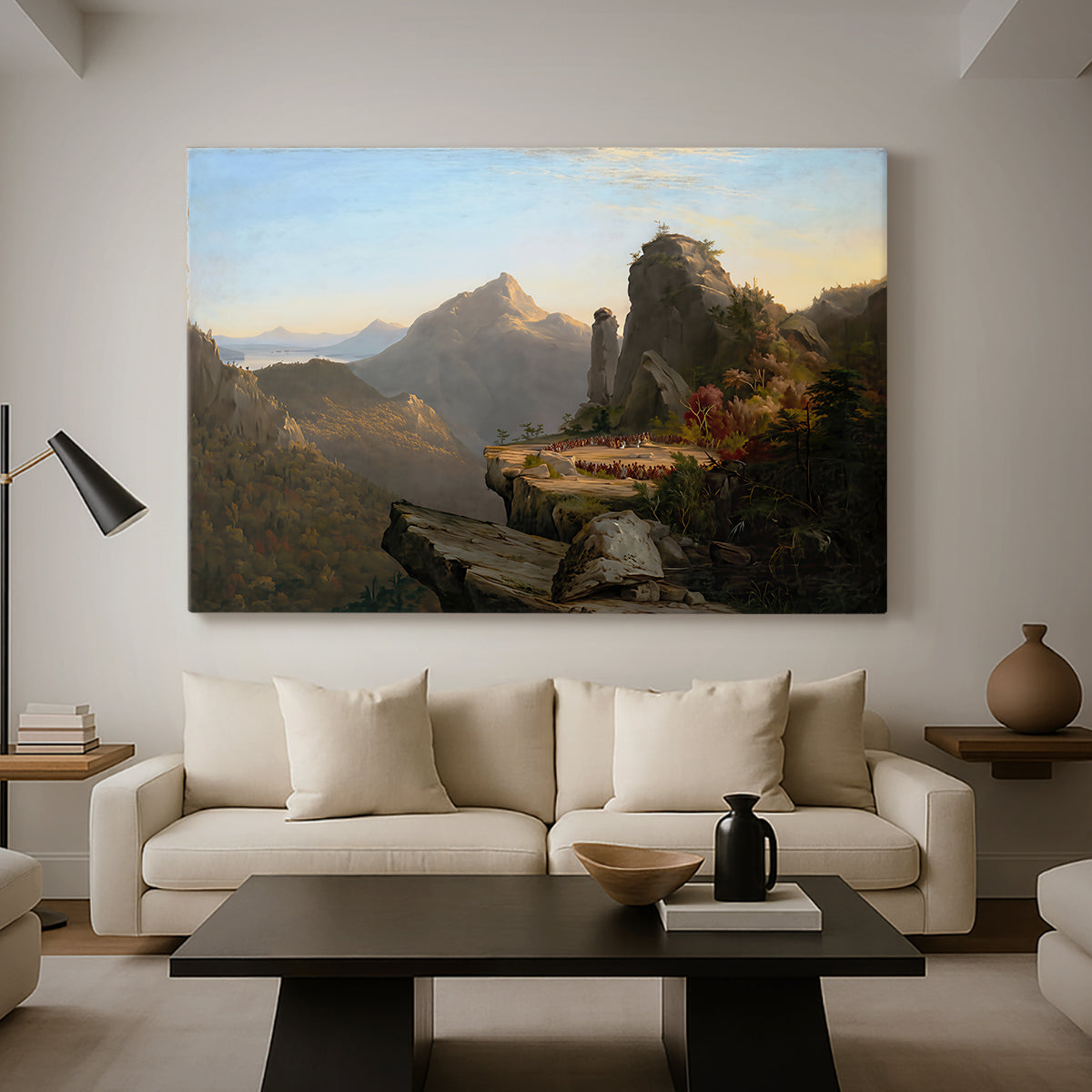 Canvas art print featuring an expansive landscape featuring cliffs, water, and distant mountains, displayed in a spacious living room