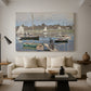 Canvas art print featuring a harbor basin filled with boats under soft sky, displayed in a spacious living room
