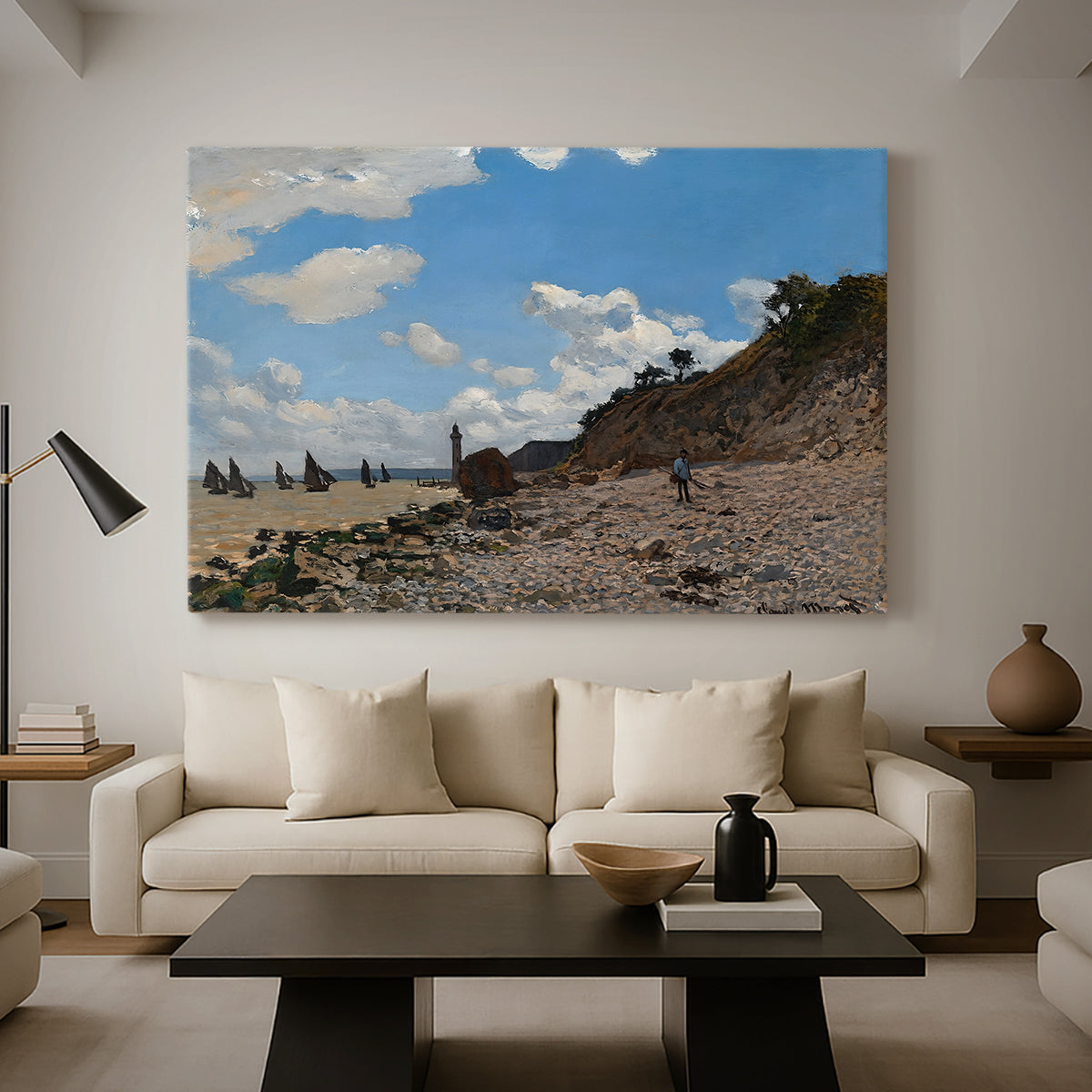 Canvas art print featuring a sandy beach with figures relaxing near water's edge, displayed in a spacious living room