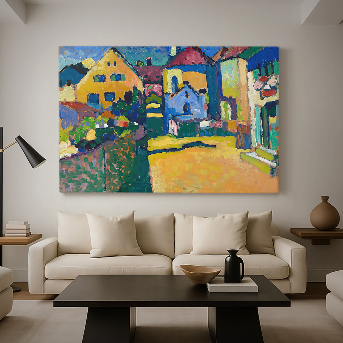 Canvas art print featuring a simplified town scene with bold blocks of color and defined outlines, displayed in a spacious living room