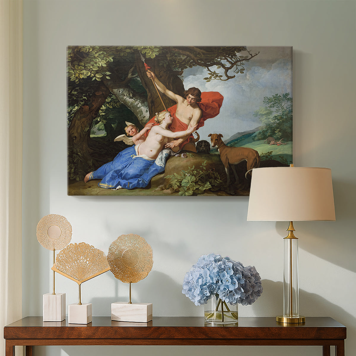 Canvas art print featuring a romantic depiction of Venus pleading with Adonis in a lush natural setting, displayed above a styled console table