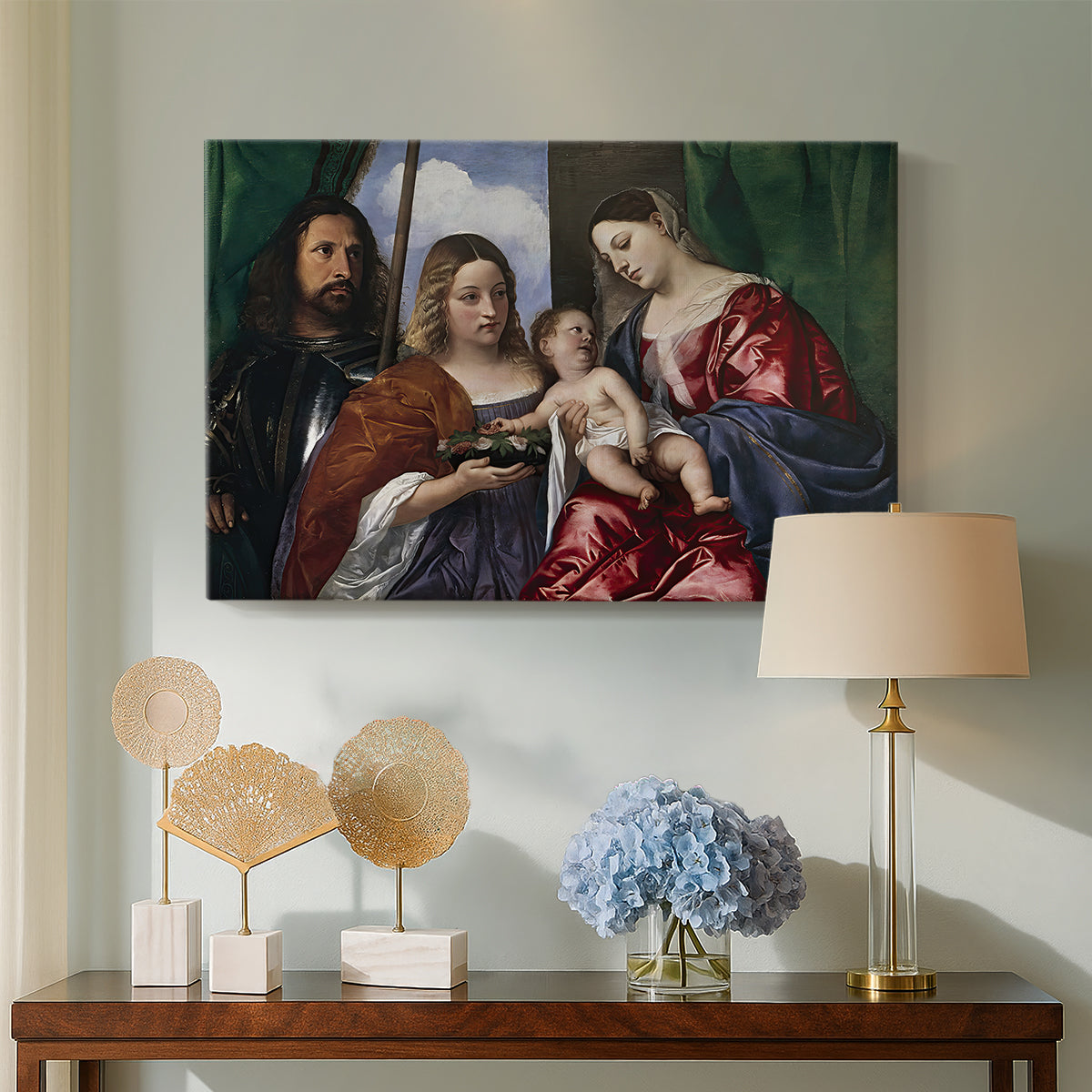 Canvas art print featuring a Renaissance devotional composition with richly dressed saints, displayed above a styled console table