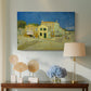 Canvas art print featuring an architectural composition featuring corner house and street, displayed above a styled console table