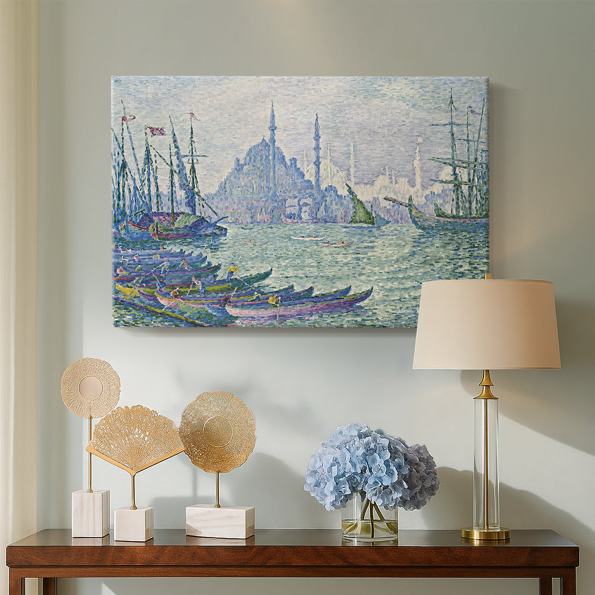 Canvas art print featuring a pointillist skyline on the water, displayed above a styled console table