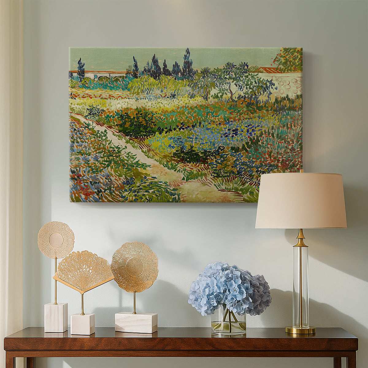 Canvas art print featuring a post-impressionist garden composition with layered greenery, displayed above a styled console table
