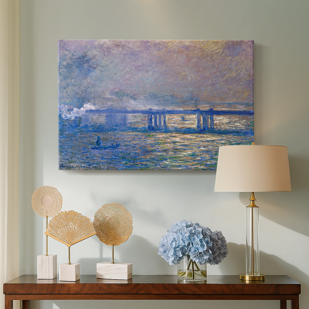 Canvas art print featuring an atmospheric depiction of London bridge with reflections in water, displayed above a styled console table