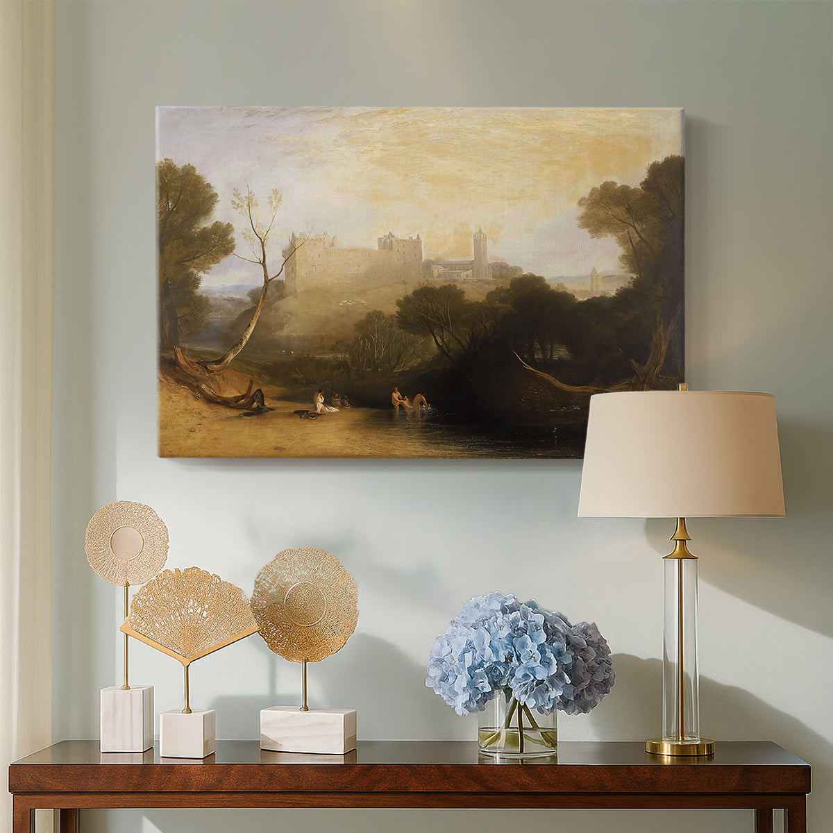 Canvas art print featuring an atmospheric landscape with building reflected near water, displayed above a styled console table