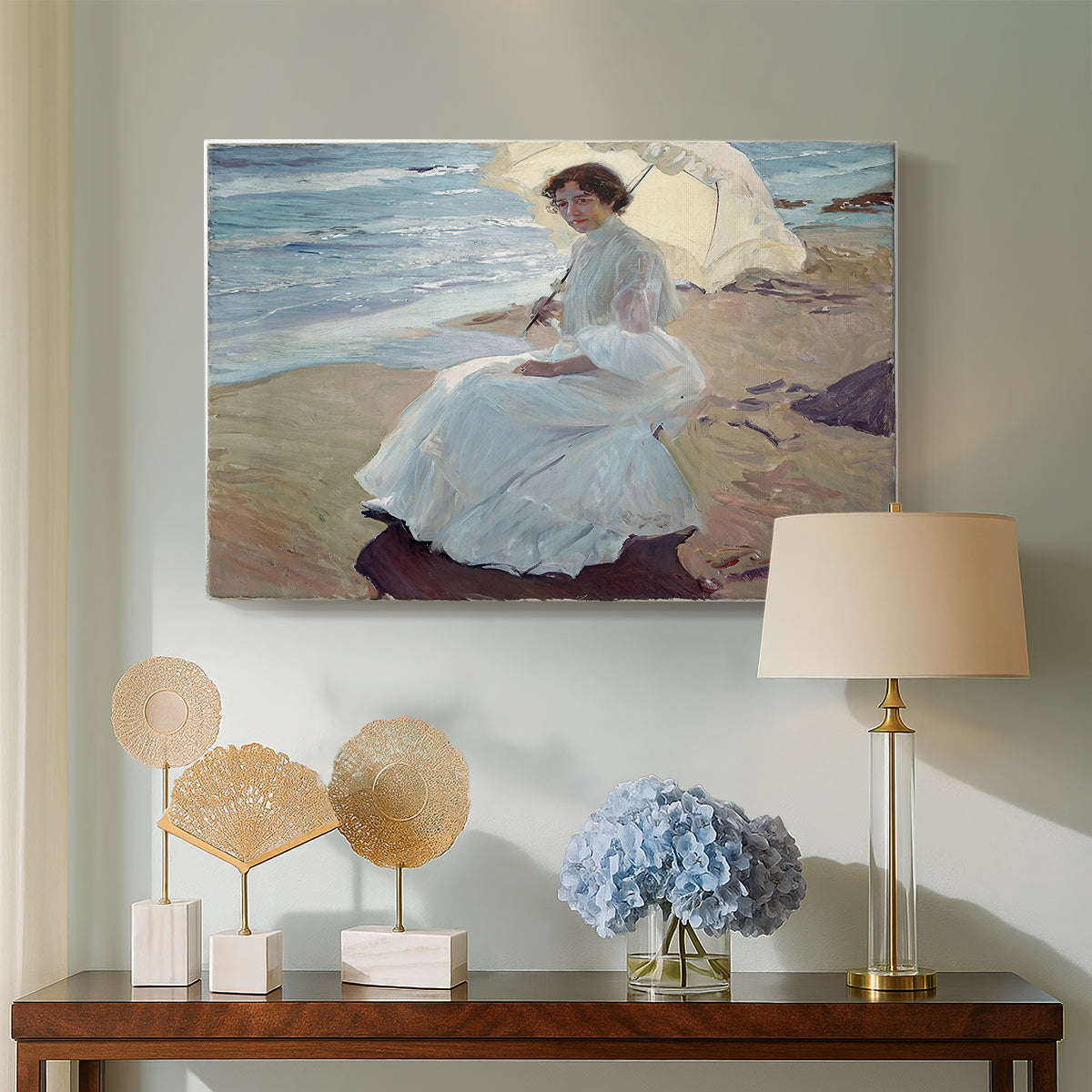 Canvas art print featuring an impressionist figure study with ocean backdrop, displayed above a styled console table