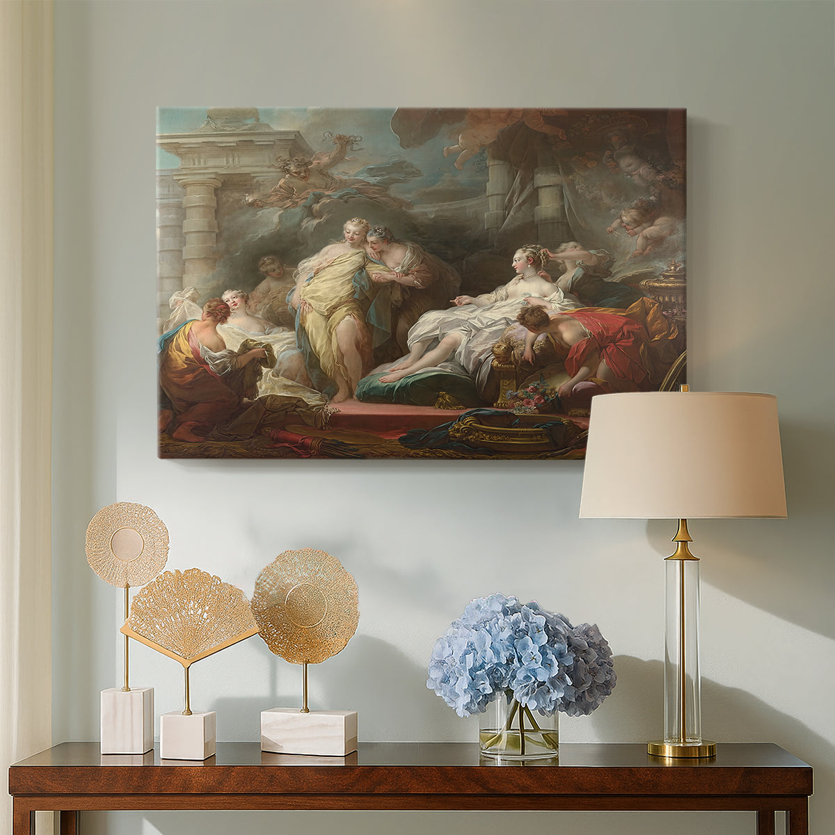 Canvas art print featuring an expressive composition with multiple women and soft drapery, displayed above a styled console table
