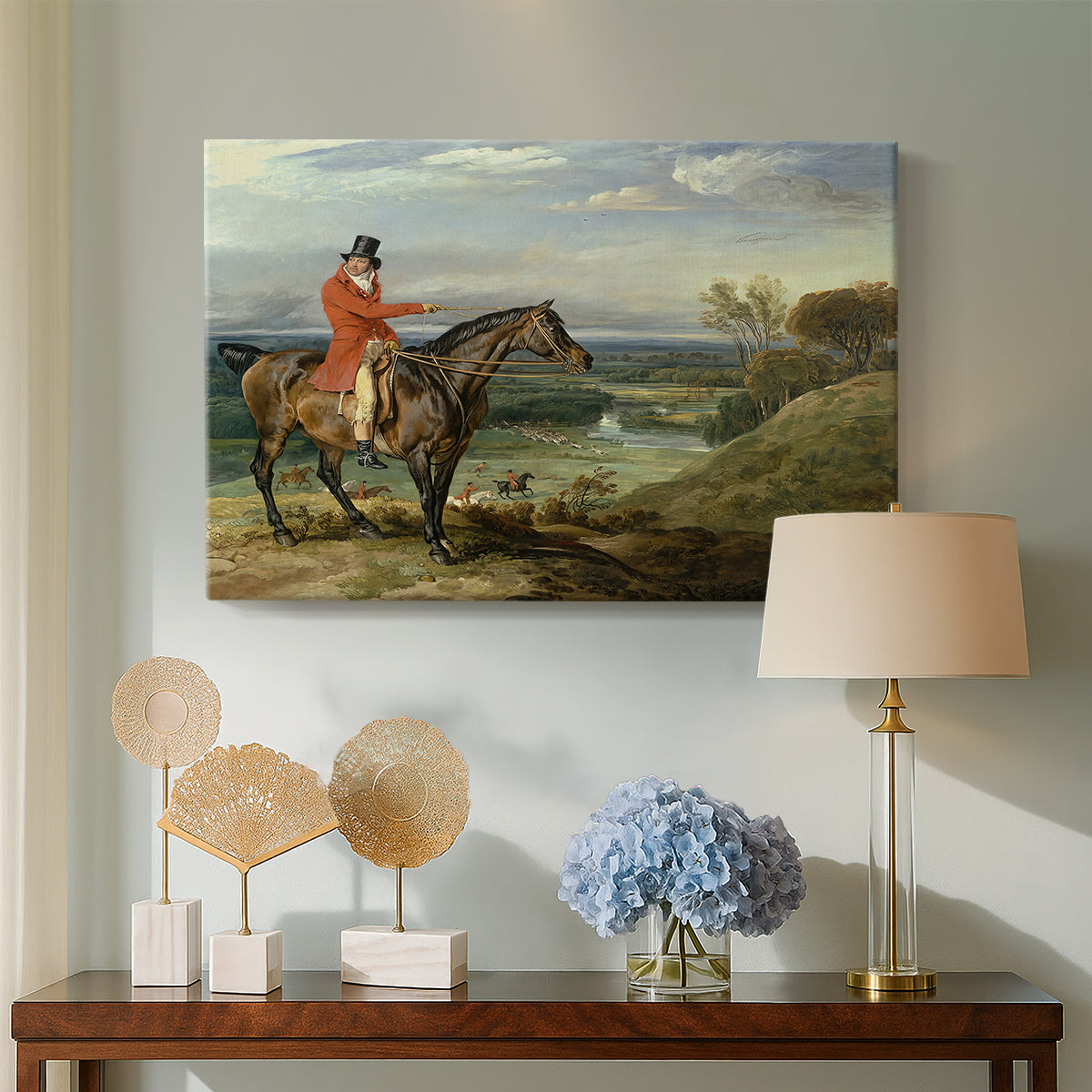 Canvas art print featuring a countryside composition showing active hunt in progress, displayed above a styled console table