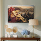 Canvas art print featuring a religious scene with angel defeating snake in dramatic pose, displayed above a styled console table