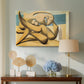 Canvas art print featuring a geometric interpretation of figures in coastal setting, displayed above a styled console table