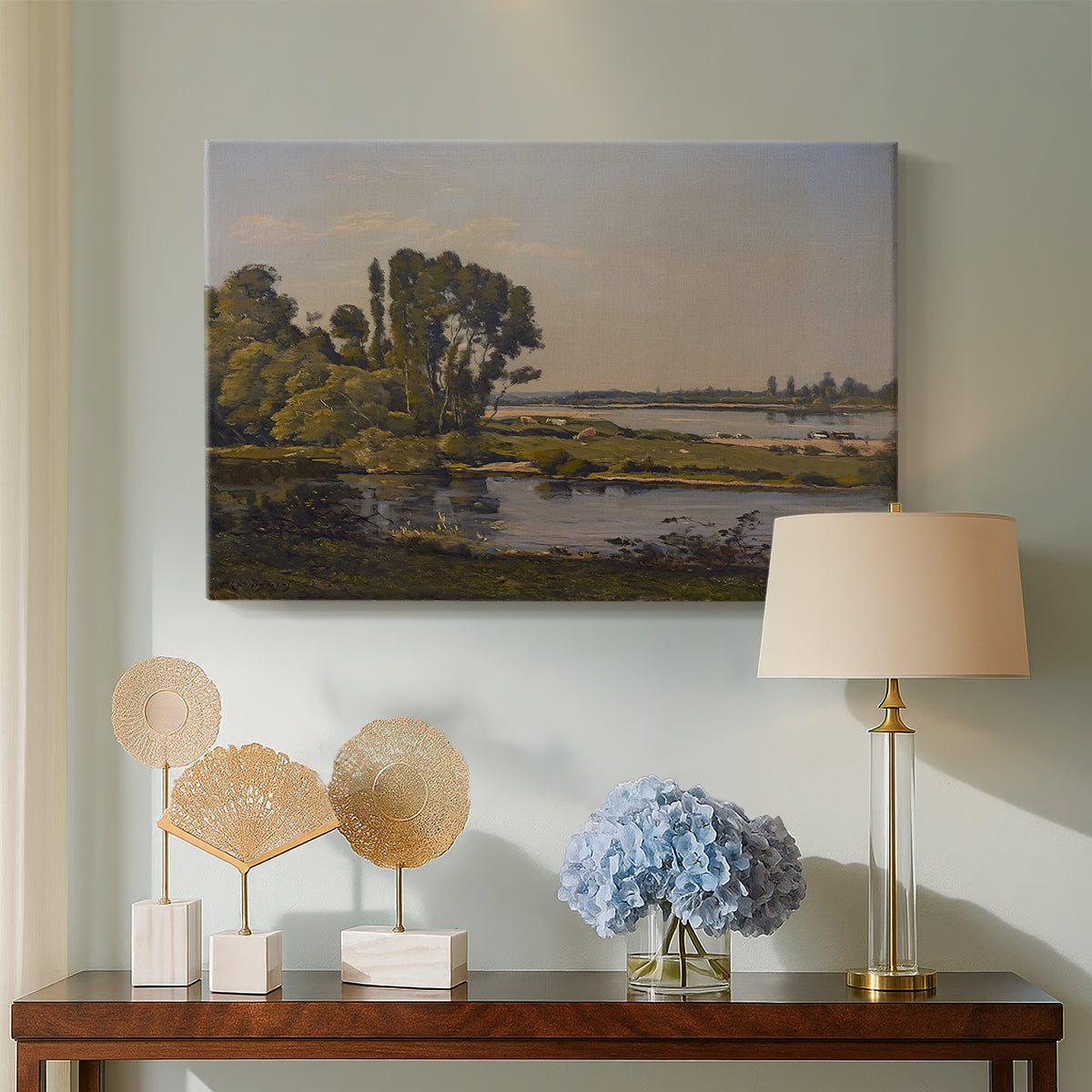 Canvas art print featuring a tranquil natural setting with river and distant horizon, displayed above a styled console table