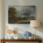 Canvas art print featuring a countryside scene with architecture, displayed above a styled console table