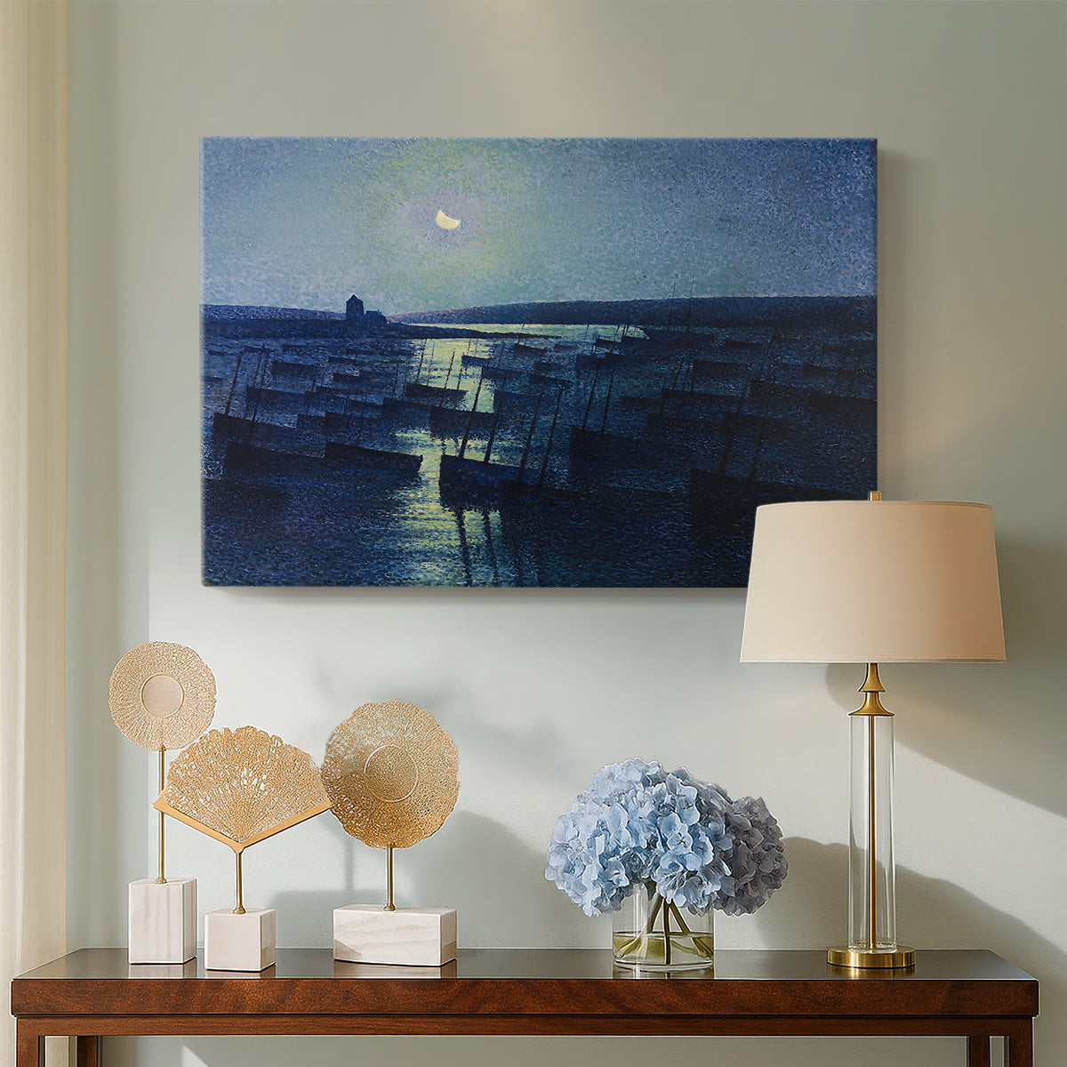 Canvas art print featuring a pointillist night composition with water, displayed above a styled console table
