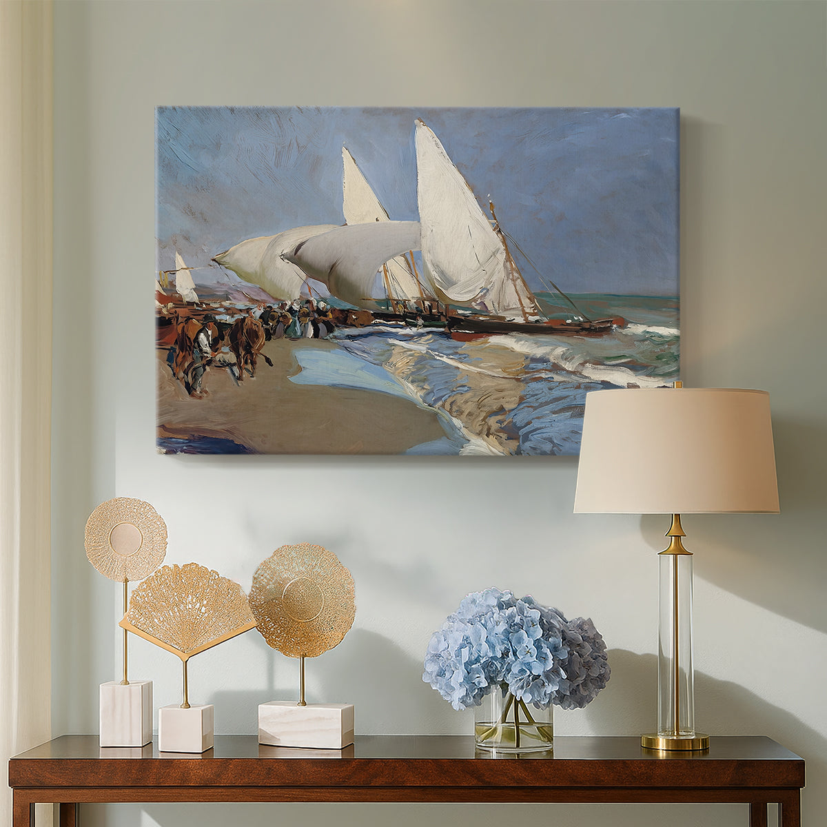 Canvas art print featuring an impressionist beach view with transport and figures, displayed above a styled console table