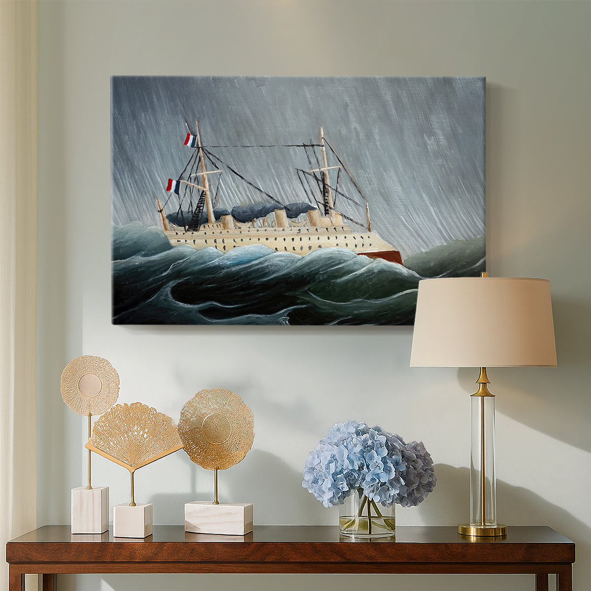 Canvas art print featuring a nautical scene with ship battling turbulent waters, displayed above a styled console table